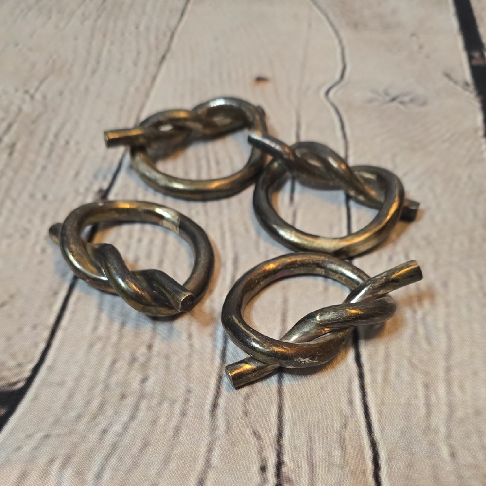 Set of Four Silver Tone Metal Knot Napkin Rings